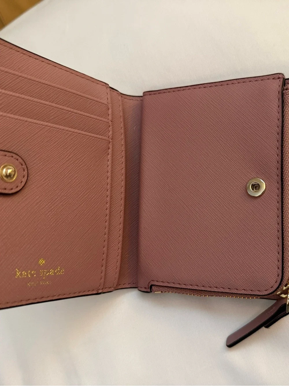 kate spade mauve pink leather zip wallet with gold plaque